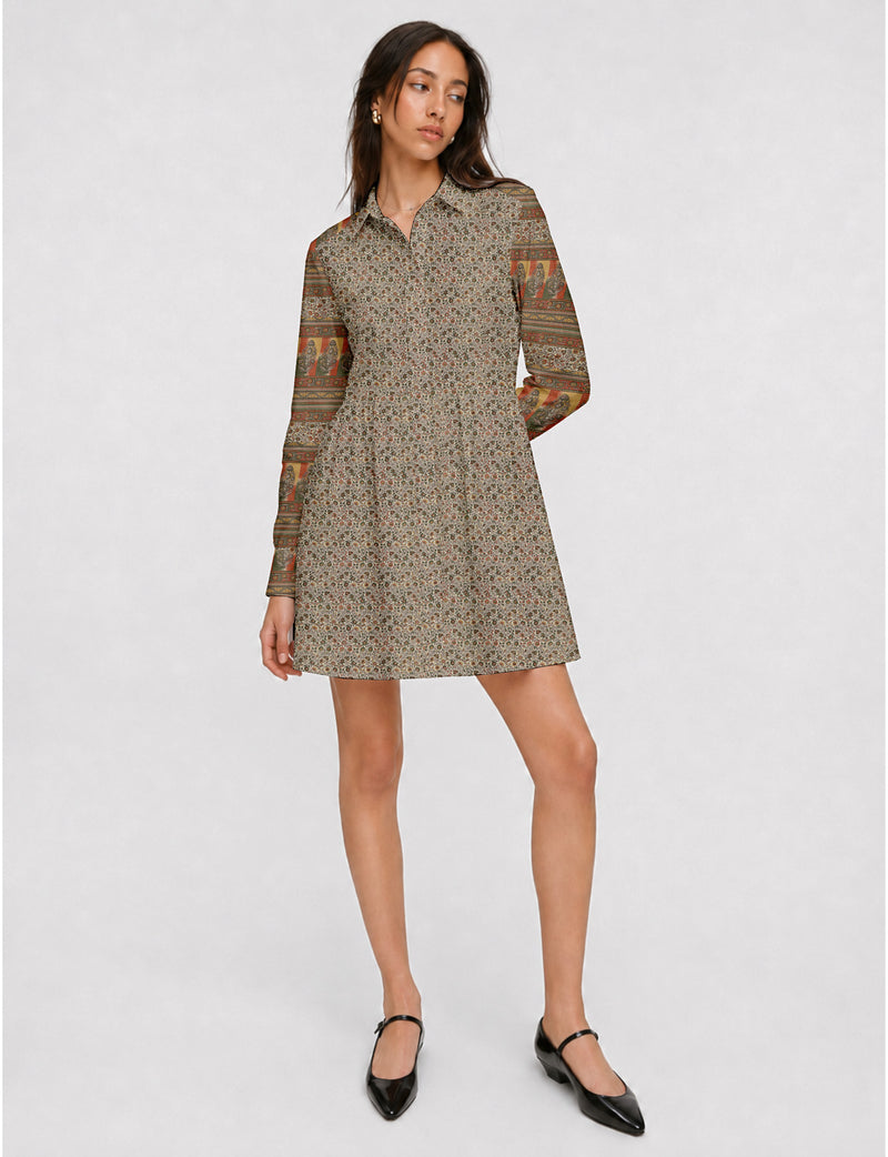 Short shirt dress with a relaxed A-line silhouette, point collar, partial button placket, gathered waist, side pockets, and full-length cuffed sleeves.