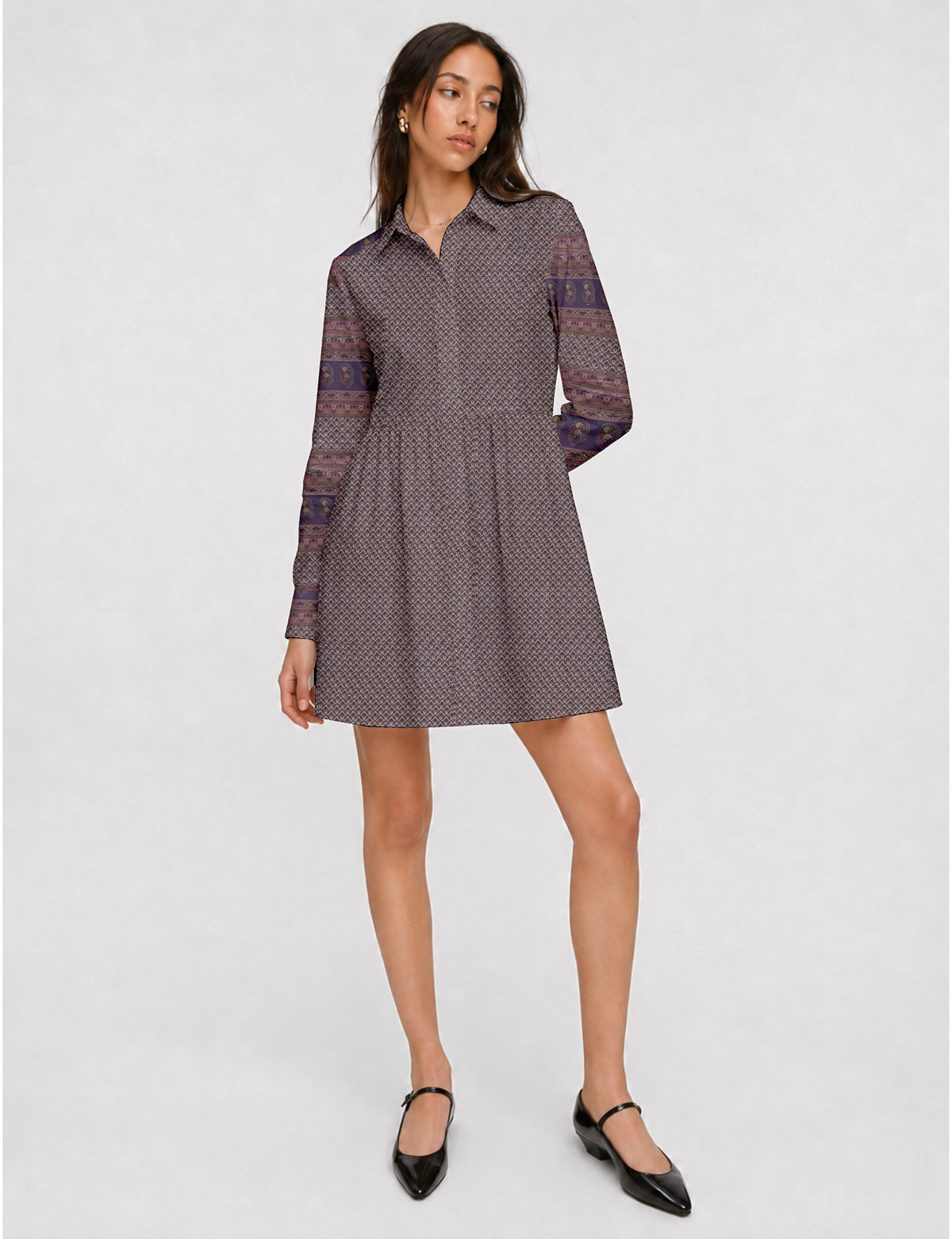 Short shirt dress with a relaxed A-line silhouette, point collar, partial button placket, gathered waist, side pockets, and full-length cuffed sleeves.