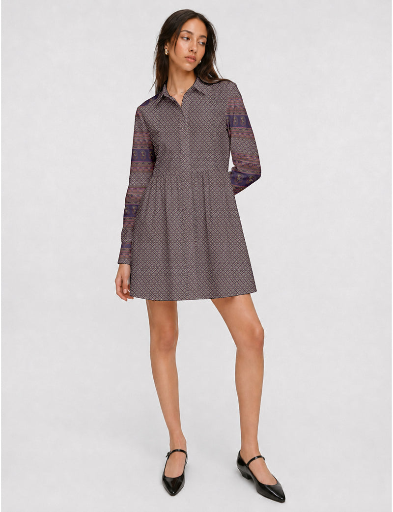 Short shirt dress with a relaxed A-line silhouette, point collar, partial button placket, gathered waist, side pockets, and full-length cuffed sleeves.