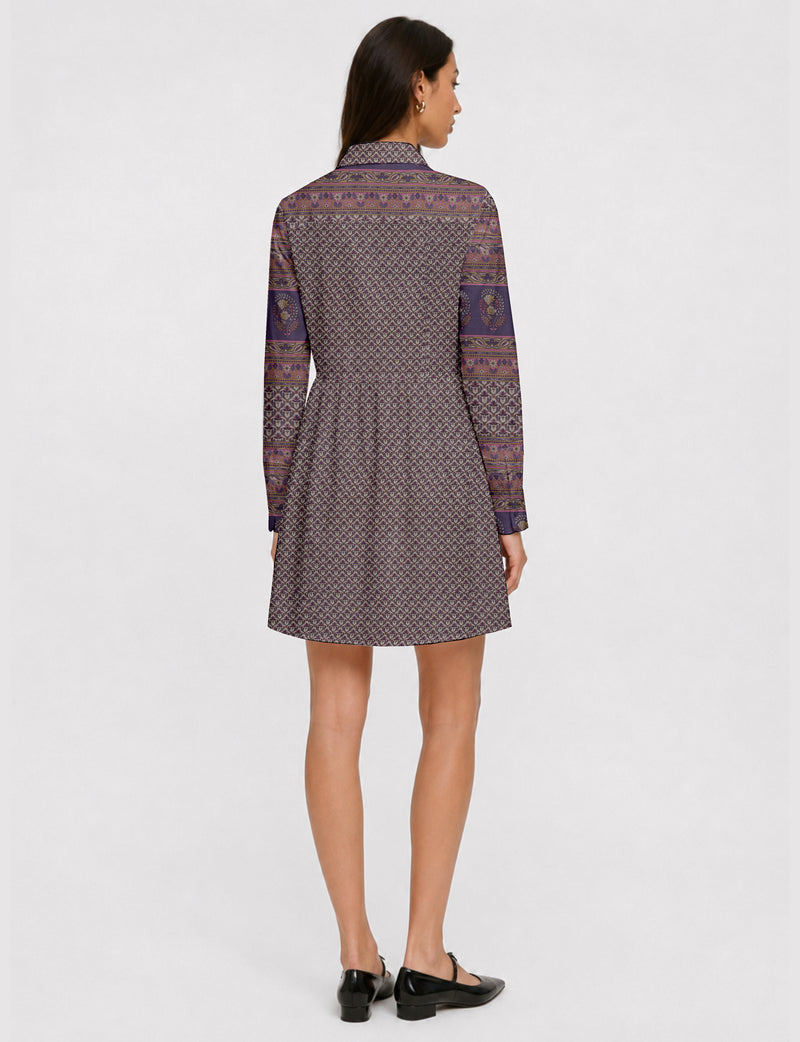 Short shirt dress with a relaxed A-line silhouette, point collar, partial button placket, gathered waist, side pockets, and full-length cuffed sleeves.