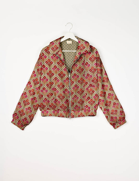 Upcycled Bomber Jacket made from recycled sari materials, featuring a cute cropped shape, elasticated hem and cuffs, and contrast sari print lining. Sustainable apparel promoting eco-friendly fashion and ethical clothing.