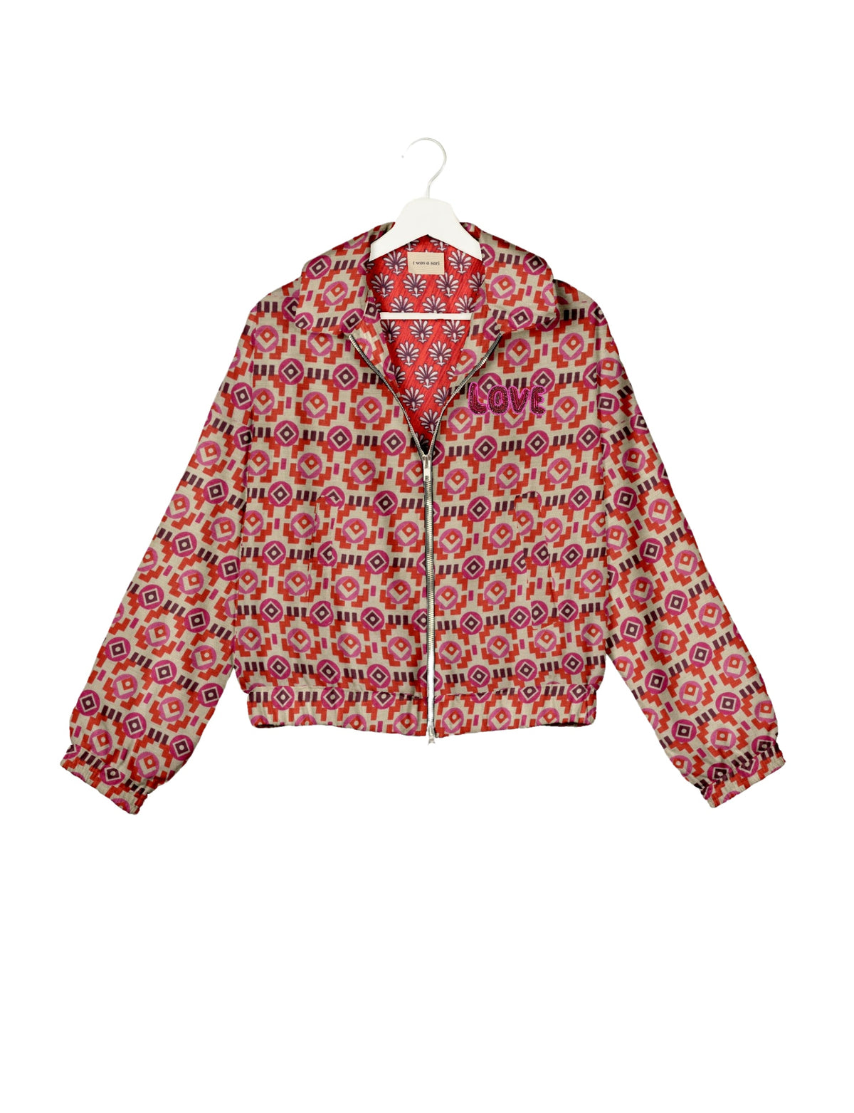 Love Bomber Jacket made from recycled fabric, featuring hand-stitched Aari embroidery. A unique piece of zero-waste clothing, part of the circular fashion movement. Designed with upcycled materials for a stylish yet environmentally friendly clothing choice.