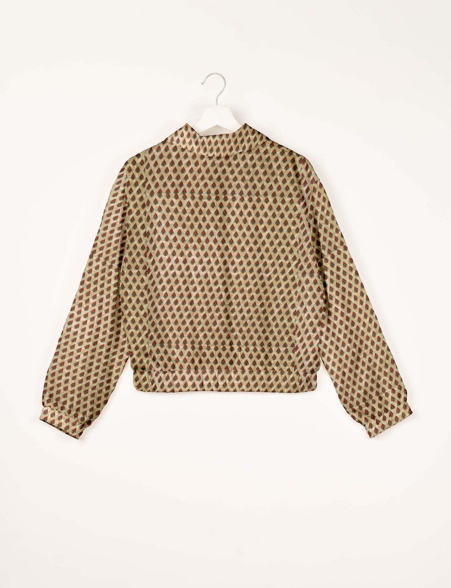 Upcycled Bomber Jacket made from recycled sari materials, featuring a cute cropped shape, elasticated hem and cuffs, and contrast sari print lining. Sustainable apparel promoting eco-friendly fashion and ethical clothing.