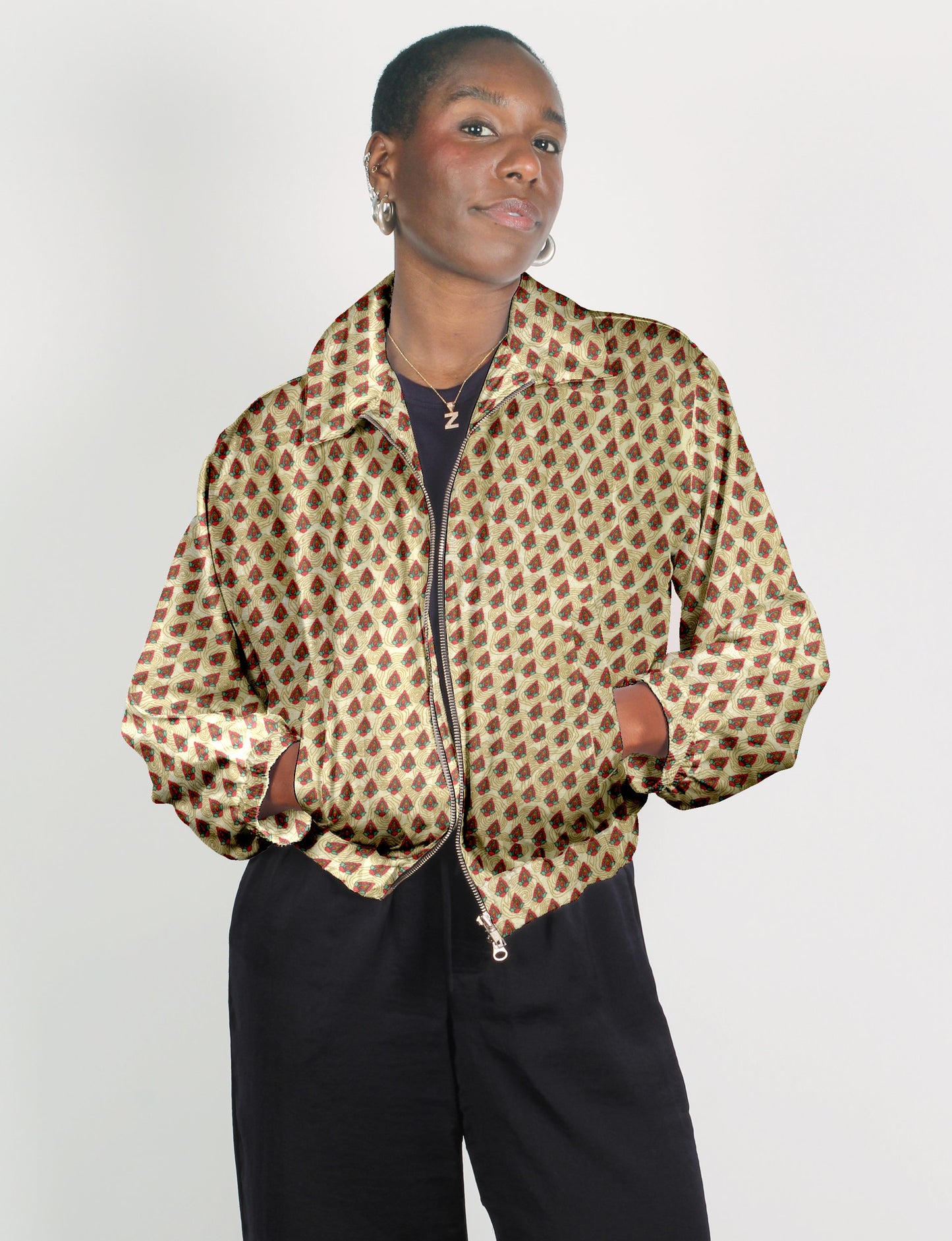 Upcycled Bomber Jacket made from recycled sari materials, featuring a cute cropped shape, elasticated hem and cuffs, and contrast sari print lining. Sustainable apparel promoting eco-friendly fashion and ethical clothing.