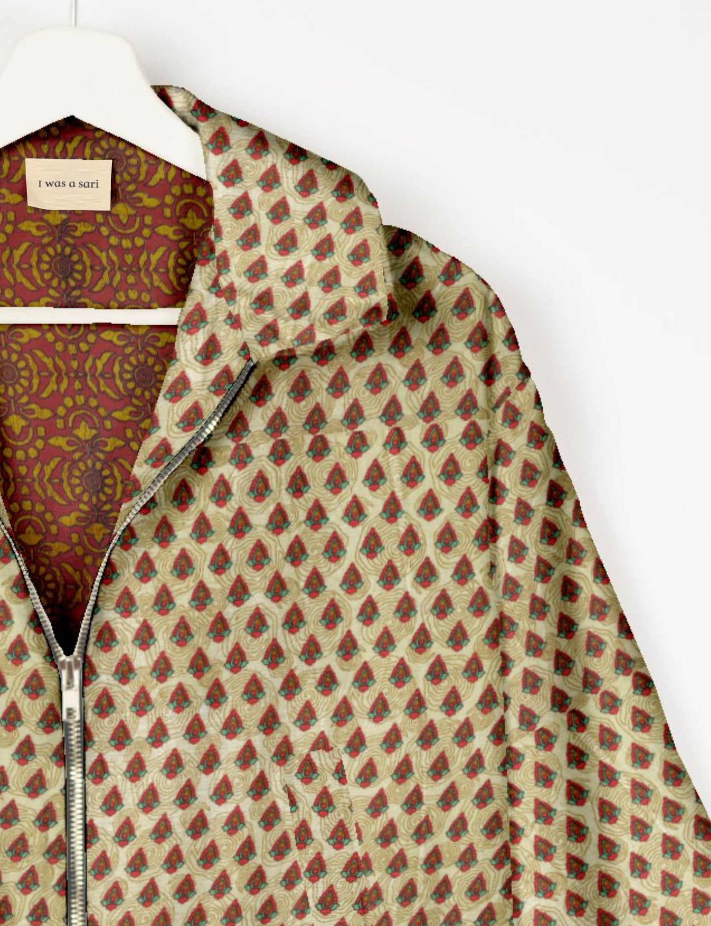 Upcycled Bomber Jacket made from recycled sari materials, featuring a cute cropped shape, elasticated hem and cuffs, and contrast sari print lining. Sustainable apparel promoting eco-friendly fashion and ethical clothing.