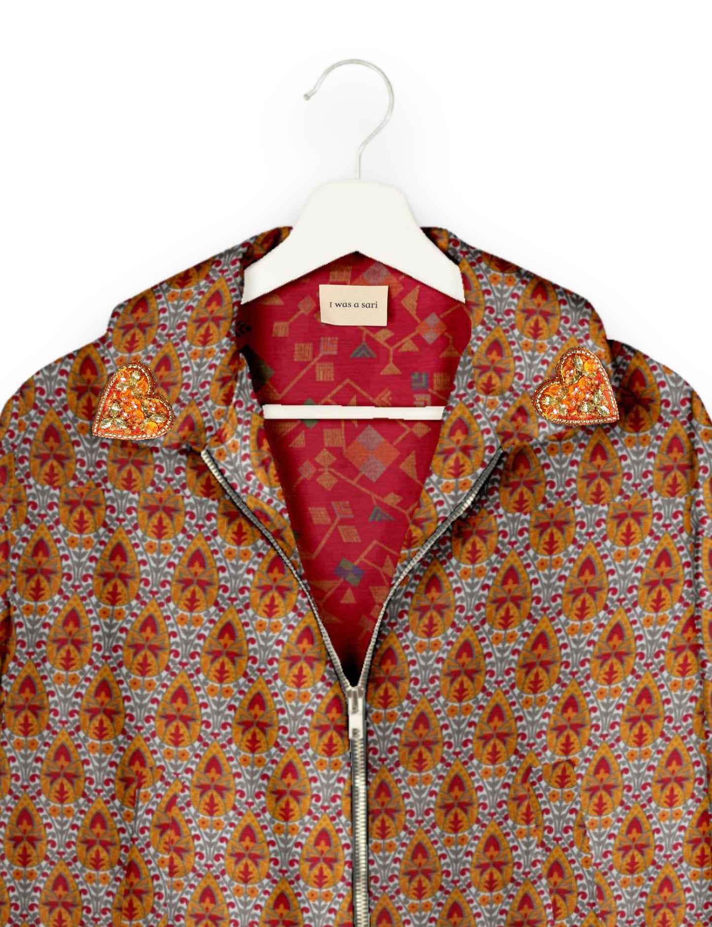 Make a bold statement with our Heart Drop Earrings, a symbol of conscious luxury and ethical fashion. Handcrafted using the intricate Aari embroidery technique, these earrings are made from upcycled sari fabric, embracing slow fashion and zero waste clothing. Elevate your look with sustainable apparel that supports fair trade fashion while reducing textile waste. Choose eco-friendly fashion that speaks of love, artistry, and responsibility.