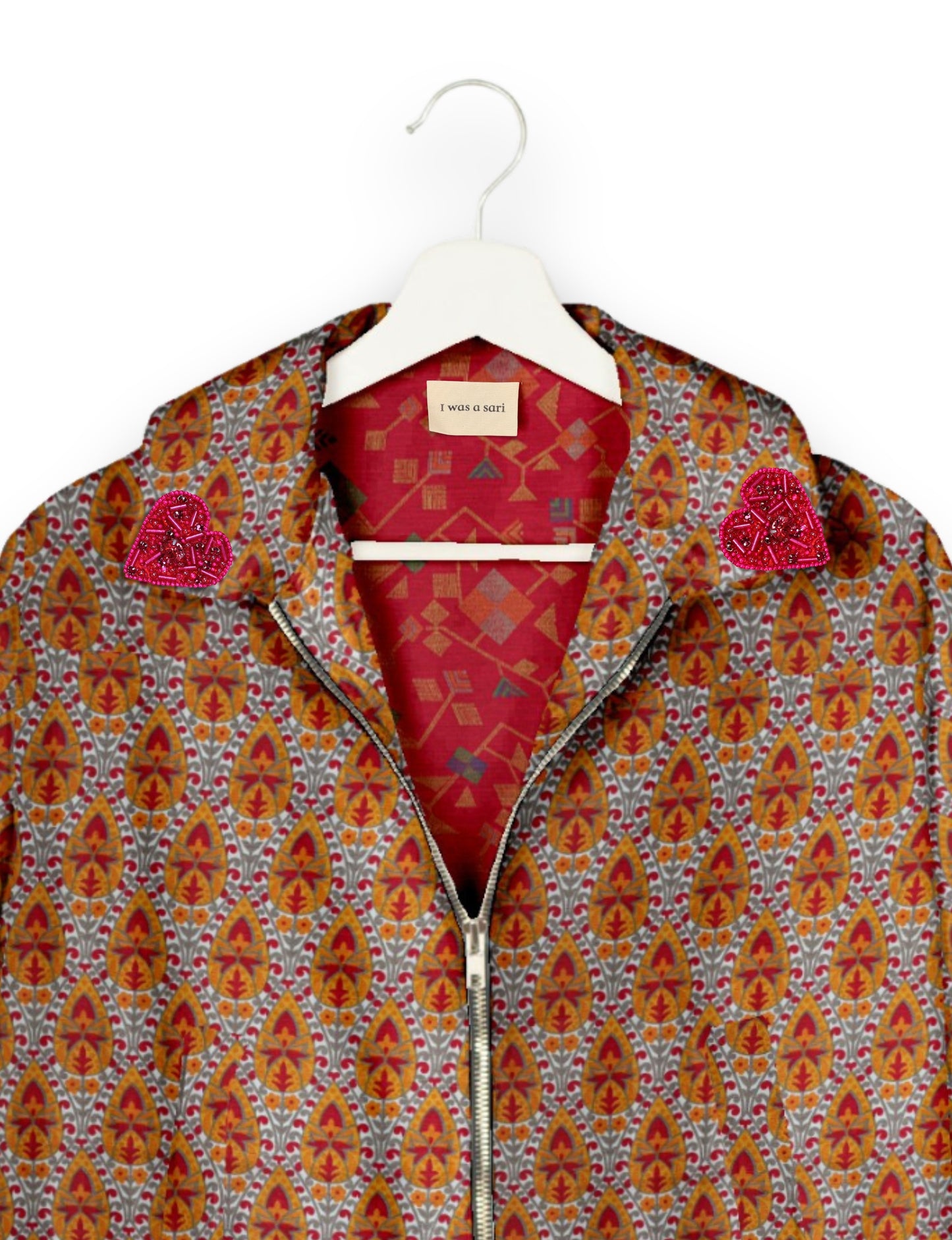 Make a bold statement with our Heart Drop Earrings, a symbol of conscious luxury and ethical fashion. Handcrafted using the intricate Aari embroidery technique, these earrings are made from upcycled sari fabric, embracing slow fashion and zero waste clothing. Elevate your look with sustainable apparel that supports fair trade fashion while reducing textile waste. Choose eco-friendly fashion that speaks of love, artistry, and responsibility.