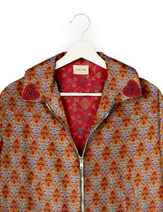 Make a bold statement with our Heart Drop Earrings, a symbol of conscious luxury and ethical fashion. Handcrafted using the intricate Aari embroidery technique, these earrings are made from upcycled sari fabric, embracing slow fashion and zero waste clothing. Elevate your look with sustainable apparel that supports fair trade fashion while reducing textile waste. Choose eco-friendly fashion that speaks of love, artistry, and responsibility.