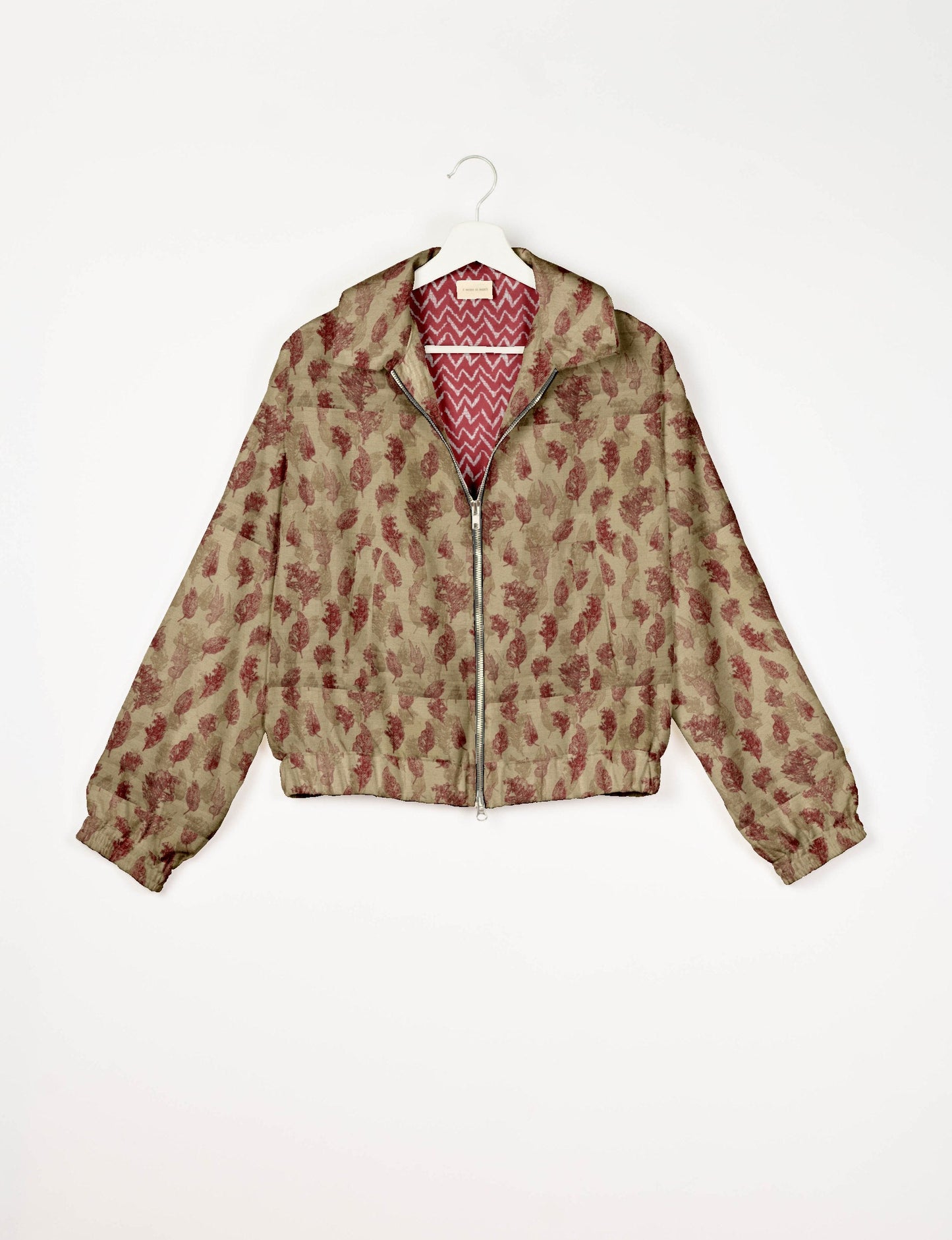 Upcycled Bomber Jacket made from recycled sari materials, featuring a cute cropped shape, elasticated hem and cuffs, and contrast sari print lining. Sustainable apparel promoting eco-friendly fashion and ethical clothing.