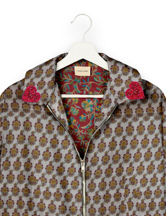 Make a bold statement with our Heart Drop Earrings, a symbol of conscious luxury and ethical fashion. Handcrafted using the intricate Aari embroidery technique, these earrings are made from upcycled sari fabric, embracing slow fashion and zero waste clothing. Elevate your look with sustainable apparel that supports fair trade fashion while reducing textile waste. Choose eco-friendly fashion that speaks of love, artistry, and responsibility.