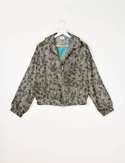 Upcycled Bomber Jacket made from recycled sari materials, featuring a cute cropped shape, elasticated hem and cuffs, and contrast sari print lining. Sustainable apparel promoting eco-friendly fashion and ethical clothing.