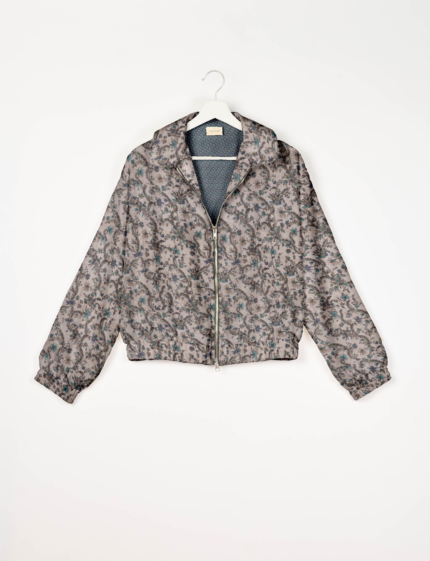 Upcycled Bomber Jacket made from recycled sari materials, featuring a cute cropped shape, elasticated hem and cuffs, and contrast sari print lining. Sustainable apparel promoting eco-friendly fashion and ethical clothing.