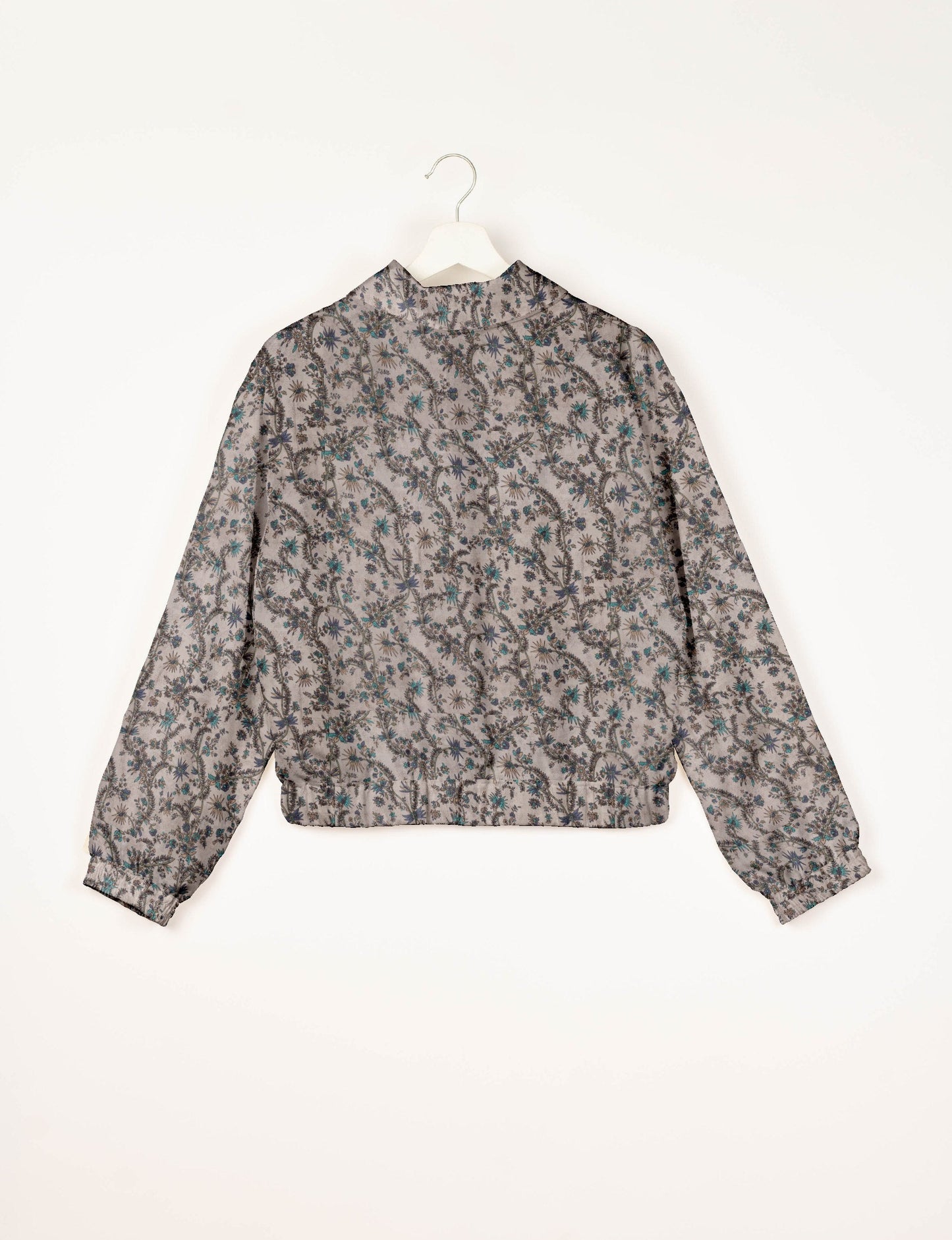 Upcycled Bomber Jacket made from recycled sari materials, featuring a cute cropped shape, elasticated hem and cuffs, and contrast sari print lining. Sustainable apparel promoting eco-friendly fashion and ethical clothing.