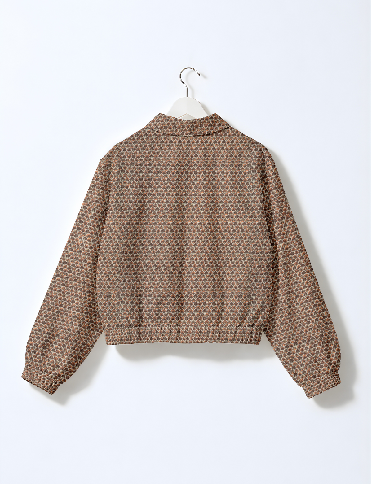 Beige bomber jacket with micro heart pattern, long sleeves, elastic cuffs, and a collar, shown from the back on a hanger