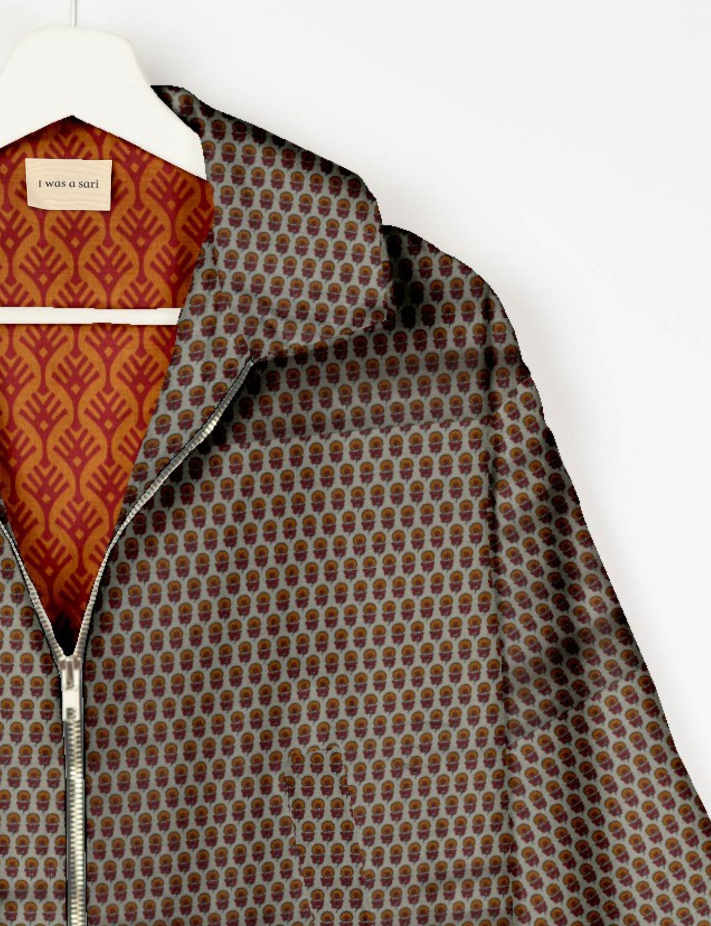 Upcycled Bomber Jacket made from recycled sari materials, featuring a cute cropped shape, elasticated hem and cuffs, and contrast sari print lining. Sustainable apparel promoting eco-friendly fashion and ethical clothing.