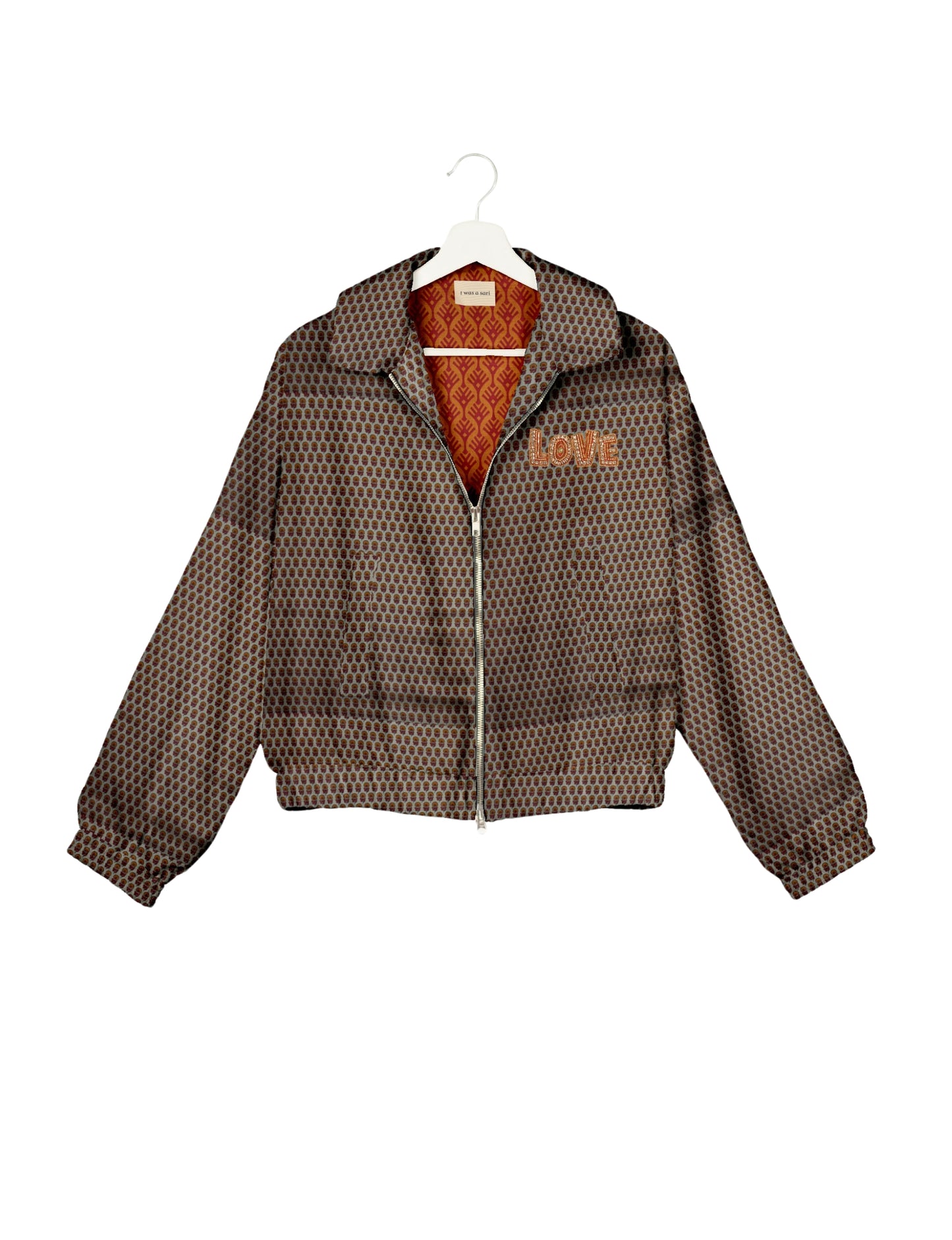 Love Bomber Jacket made from recycled fabric, featuring hand-stitched Aari embroidery. A unique piece of zero-waste clothing, part of the circular fashion movement. Designed with upcycled materials for a stylish yet environmentally friendly clothing choice.