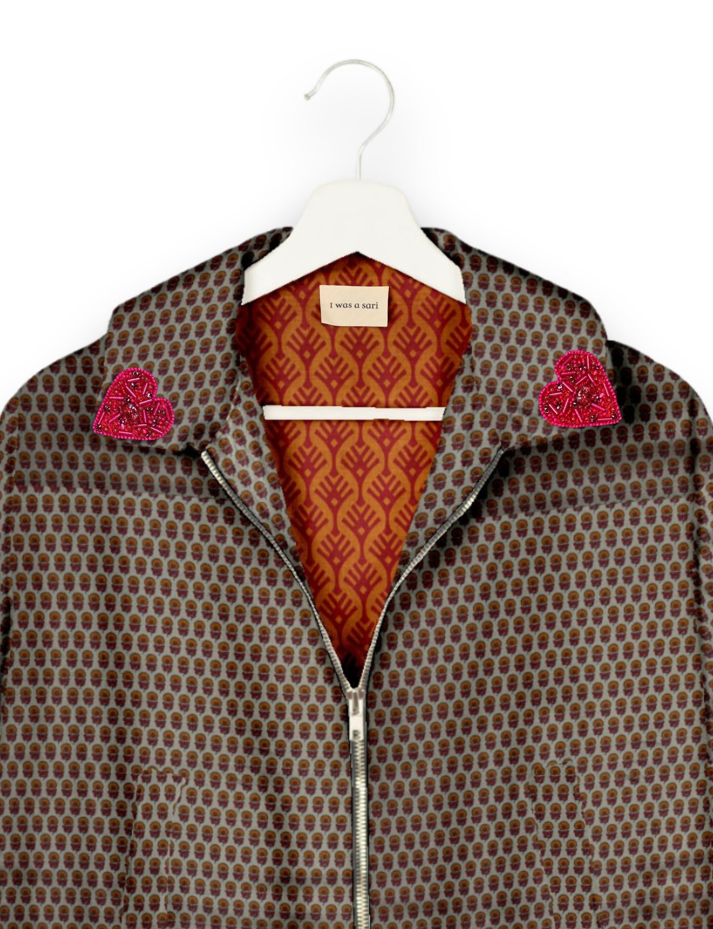 Make a bold statement with our Heart Drop Earrings, a symbol of conscious luxury and ethical fashion. Handcrafted using the intricate Aari embroidery technique, these earrings are made from upcycled sari fabric, embracing slow fashion and zero waste clothing. Elevate your look with sustainable apparel that supports fair trade fashion while reducing textile waste. Choose eco-friendly fashion that speaks of love, artistry, and responsibility.