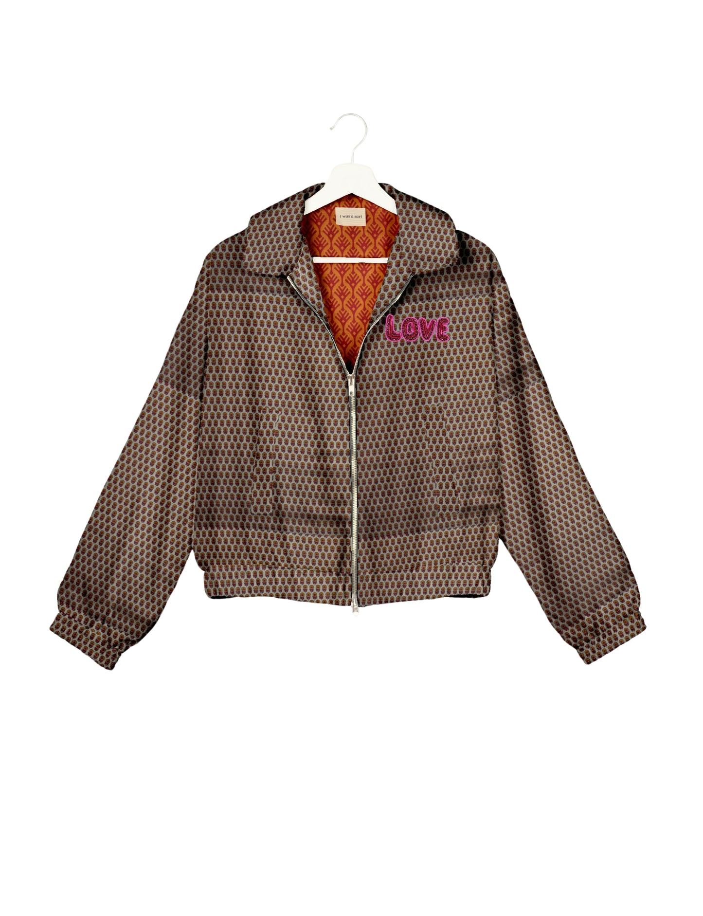 Love Bomber Jacket made from recycled fabric, featuring hand-stitched Aari embroidery. A unique piece of zero-waste clothing, part of the circular fashion movement. Designed with upcycled materials for a stylish yet environmentally friendly clothing choice.