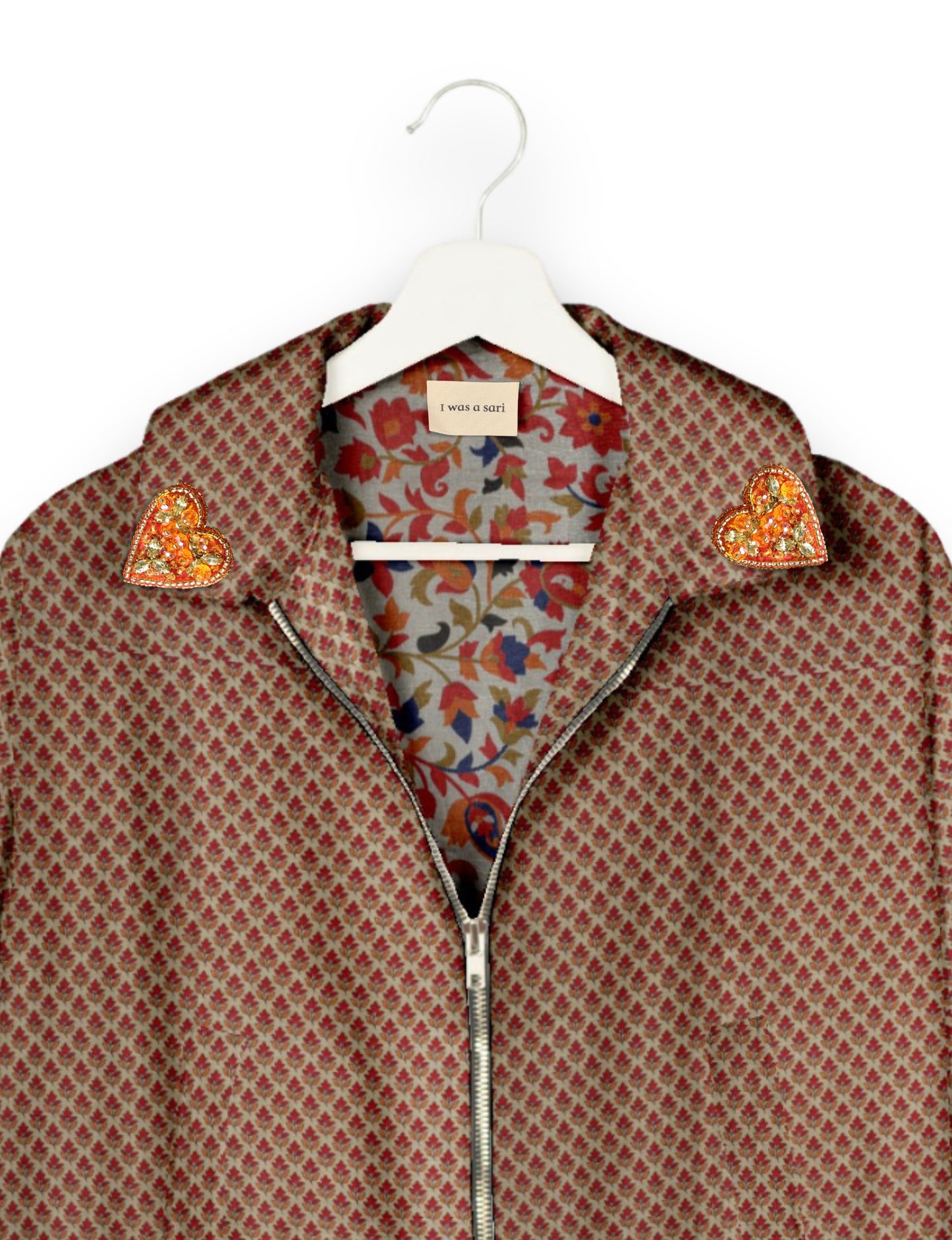 Make a bold statement with our Heart Drop Earrings, a symbol of conscious luxury and ethical fashion. Handcrafted using the intricate Aari embroidery technique, these earrings are made from upcycled sari fabric, embracing slow fashion and zero waste clothing. Elevate your look with sustainable apparel that supports fair trade fashion while reducing textile waste. Choose eco-friendly fashion that speaks of love, artistry, and responsibility.