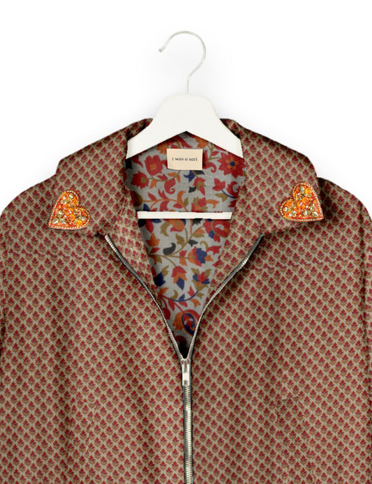 Make a bold statement with our Heart Drop Earrings, a symbol of conscious luxury and ethical fashion. Handcrafted using the intricate Aari embroidery technique, these earrings are made from upcycled sari fabric, embracing slow fashion and zero waste clothing. Elevate your look with sustainable apparel that supports fair trade fashion while reducing textile waste. Choose eco-friendly fashion that speaks of love, artistry, and responsibility.