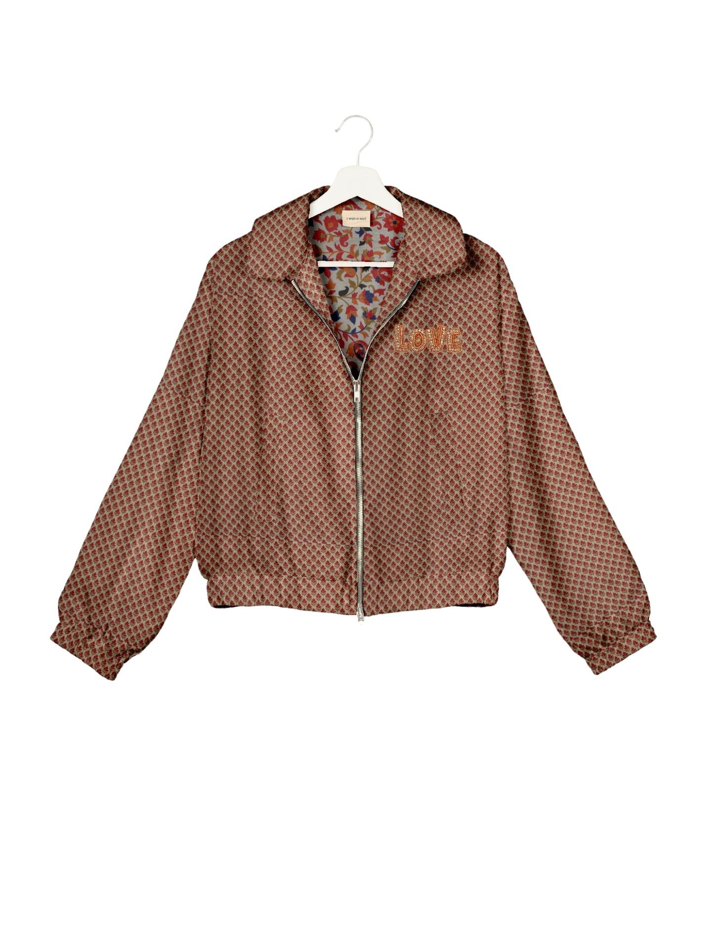 Love Bomber Jacket made from recycled fabric, featuring hand-stitched Aari embroidery. A unique piece of zero-waste clothing, part of the circular fashion movement. Designed with upcycled materials for a stylish yet environmentally friendly clothing choice.