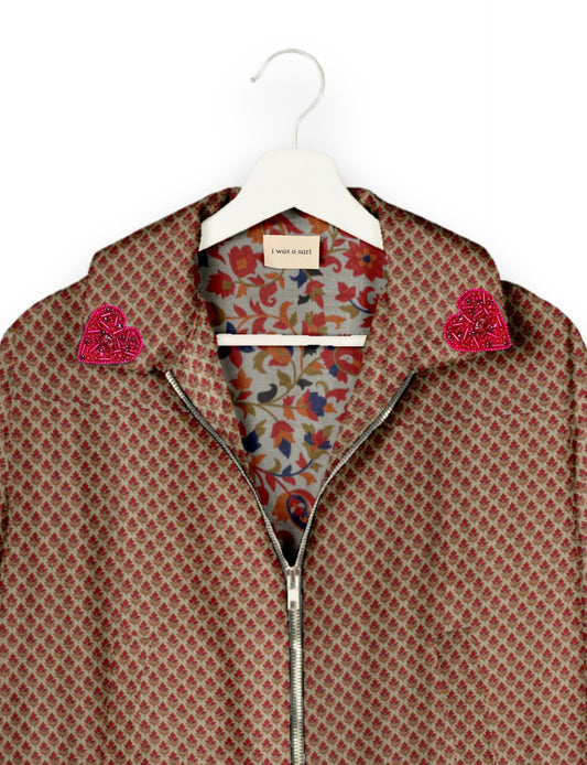 Make a bold statement with our Heart Drop Earrings, a symbol of conscious luxury and ethical fashion. Handcrafted using the intricate Aari embroidery technique, these earrings are made from upcycled sari fabric, embracing slow fashion and zero waste clothing. Elevate your look with sustainable apparel that supports fair trade fashion while reducing textile waste. Choose eco-friendly fashion that speaks of love, artistry, and responsibility.