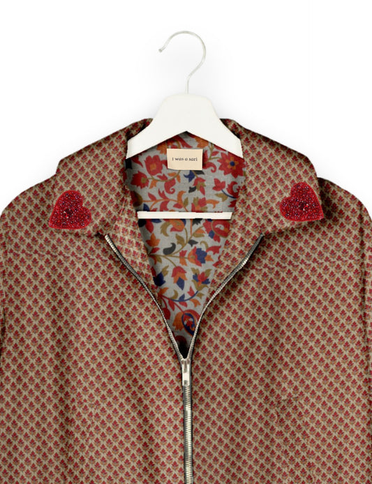 Make a bold statement with our Heart Drop Earrings, a symbol of conscious luxury and ethical fashion. Handcrafted using the intricate Aari embroidery technique, these earrings are made from upcycled sari fabric, embracing slow fashion and zero waste clothing. Elevate your look with sustainable apparel that supports fair trade fashion while reducing textile waste. Choose eco-friendly fashion that speaks of love, artistry, and responsibility.