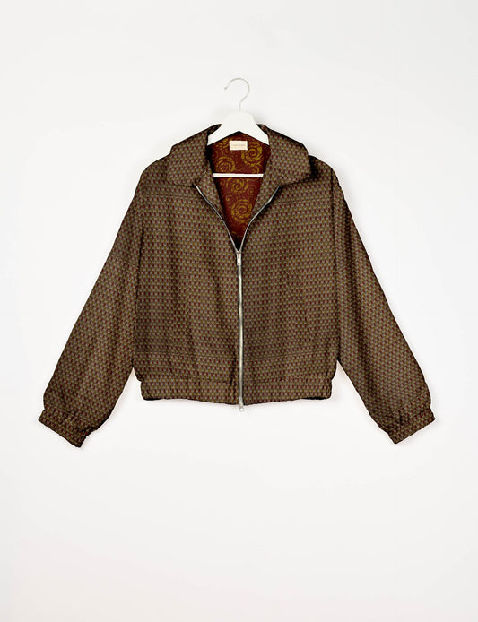 Upcycled Bomber Jacket made from recycled sari materials, featuring a cute cropped shape, elasticated hem and cuffs, and contrast sari print lining. Sustainable apparel promoting eco-friendly fashion and ethical clothing.