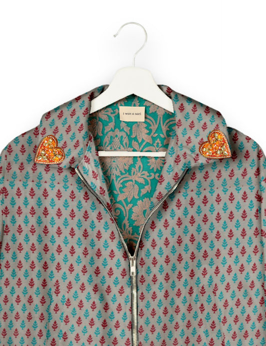 Make a bold statement with our Heart Drop Earrings, a symbol of conscious luxury and ethical fashion. Handcrafted using the intricate Aari embroidery technique, these earrings are made from upcycled sari fabric, embracing slow fashion and zero waste clothing. Elevate your look with sustainable apparel that supports fair trade fashion while reducing textile waste. Choose eco-friendly fashion that speaks of love, artistry, and responsibility.