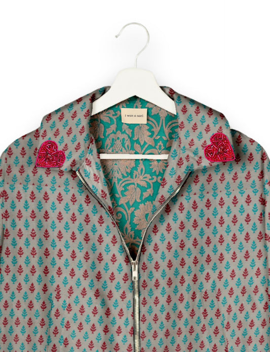 Make a bold statement with our Heart Drop Earrings, a symbol of conscious luxury and ethical fashion. Handcrafted using the intricate Aari embroidery technique, these earrings are made from upcycled sari fabric, embracing slow fashion and zero waste clothing. Elevate your look with sustainable apparel that supports fair trade fashion while reducing textile waste. Choose eco-friendly fashion that speaks of love, artistry, and responsibility.