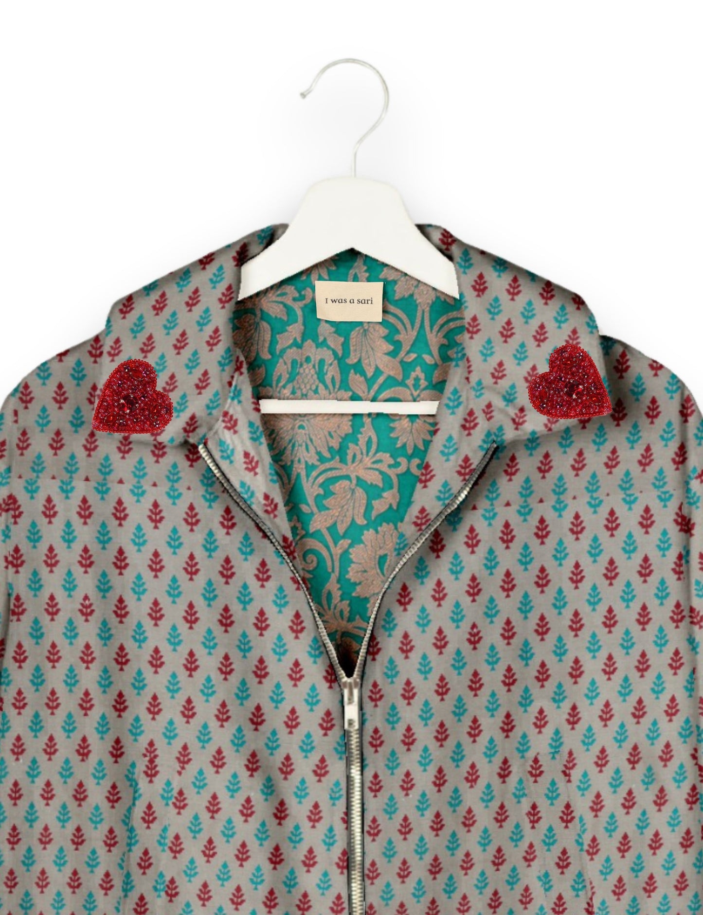 Make a bold statement with our Heart Drop Earrings, a symbol of conscious luxury and ethical fashion. Handcrafted using the intricate Aari embroidery technique, these earrings are made from upcycled sari fabric, embracing slow fashion and zero waste clothing. Elevate your look with sustainable apparel that supports fair trade fashion while reducing textile waste. Choose eco-friendly fashion that speaks of love, artistry, and responsibility.