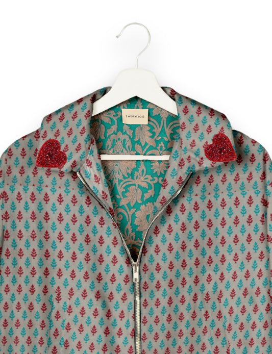 Make a bold statement with our Heart Drop Earrings, a symbol of conscious luxury and ethical fashion. Handcrafted using the intricate Aari embroidery technique, these earrings are made from upcycled sari fabric, embracing slow fashion and zero waste clothing. Elevate your look with sustainable apparel that supports fair trade fashion while reducing textile waste. Choose eco-friendly fashion that speaks of love, artistry, and responsibility.