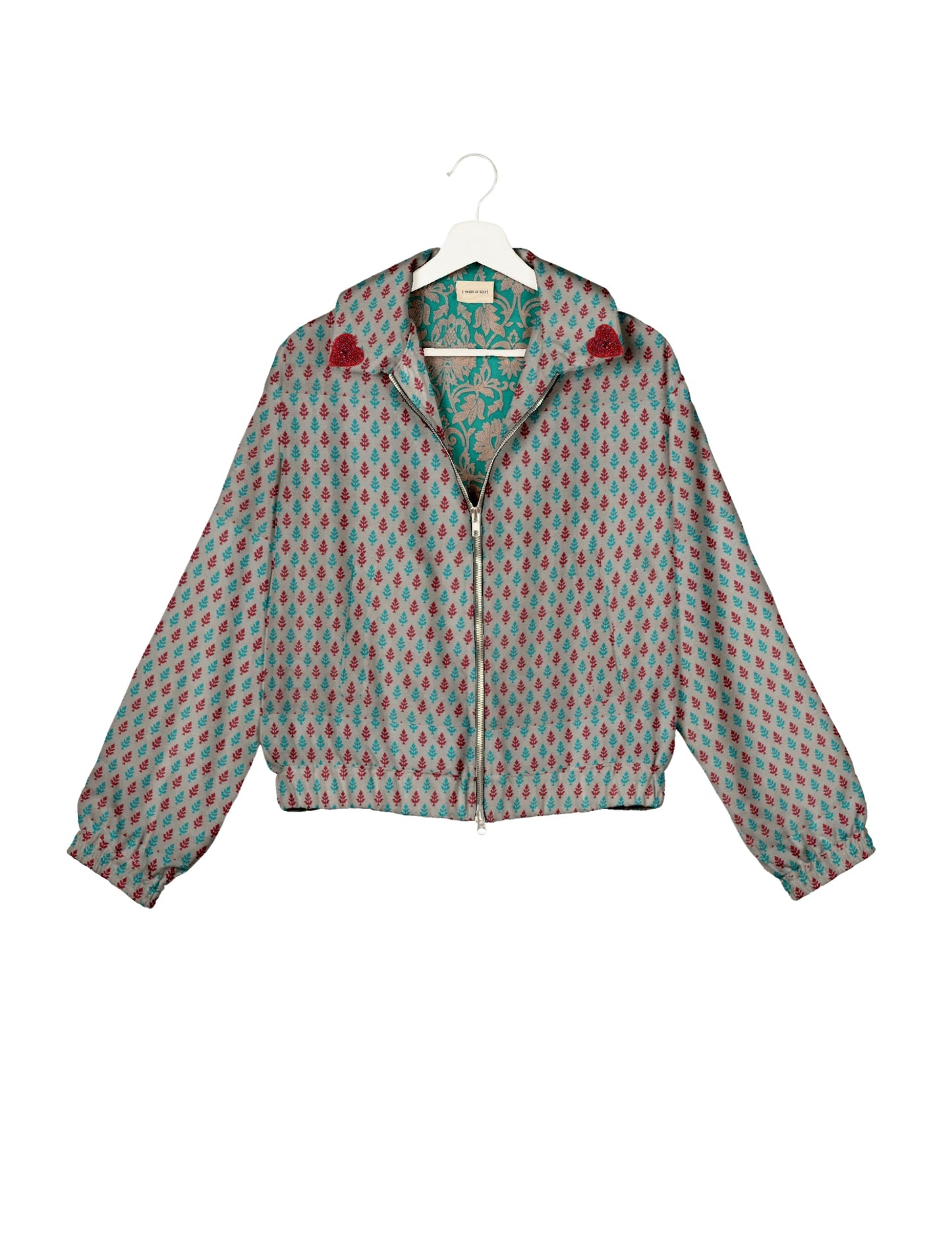 Make a bold statement with our Heart Drop Earrings, a symbol of conscious luxury and ethical fashion. Handcrafted using the intricate Aari embroidery technique, these earrings are made from upcycled sari fabric, embracing slow fashion and zero waste clothing. Elevate your look with sustainable apparel that supports fair trade fashion while reducing textile waste. Choose eco-friendly fashion that speaks of love, artistry, and responsibility.