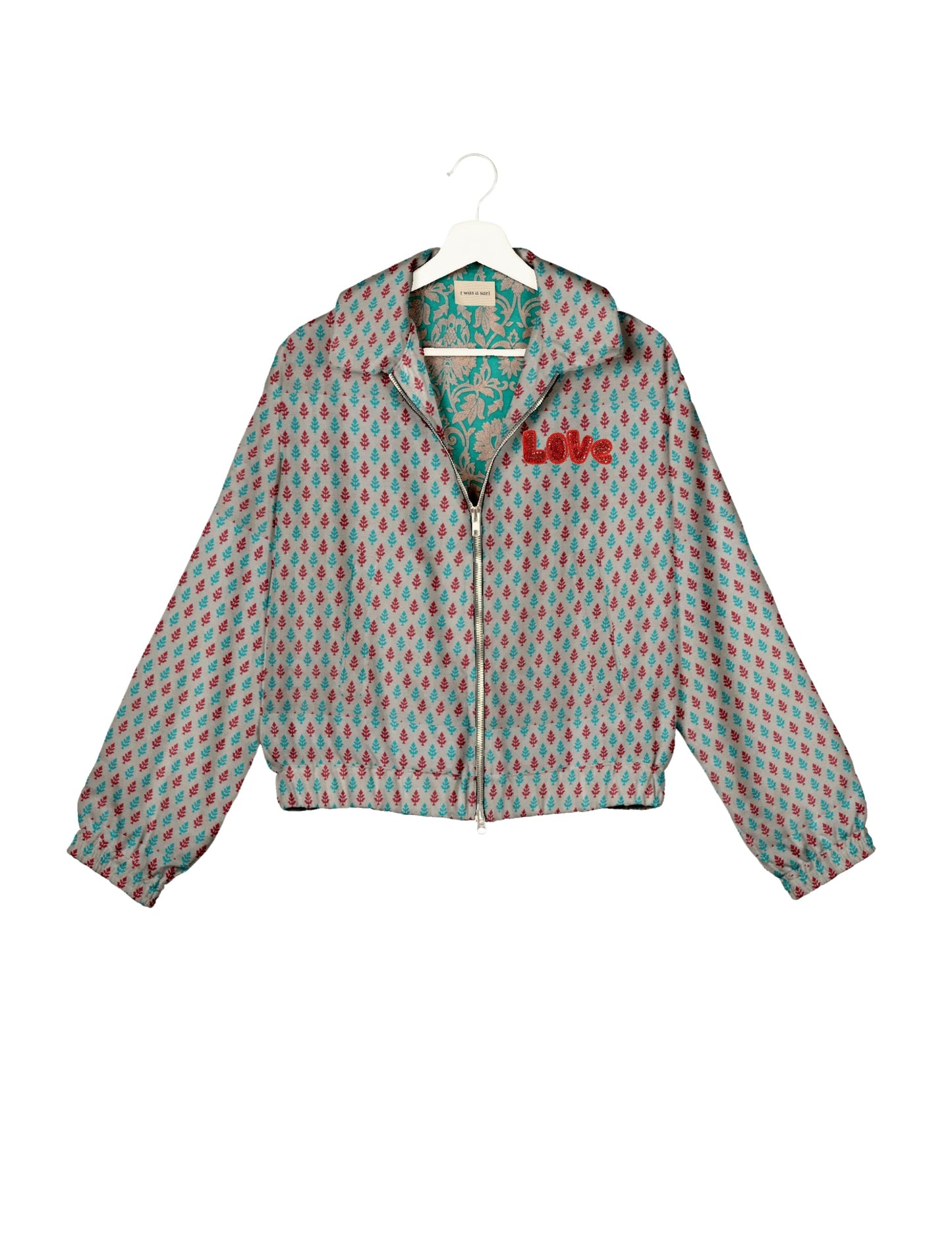 Love Bomber Jacket made from recycled fabric, featuring hand-stitched Aari embroidery. A unique piece of zero-waste clothing, part of the circular fashion movement. Designed with upcycled materials for a stylish yet environmentally friendly clothing choice.