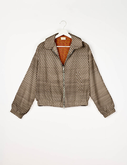 Upcycled Bomber Jacket made from recycled sari materials, featuring a cute cropped shape, elasticated hem and cuffs, and contrast sari print lining. Sustainable apparel promoting eco-friendly fashion and ethical clothing.