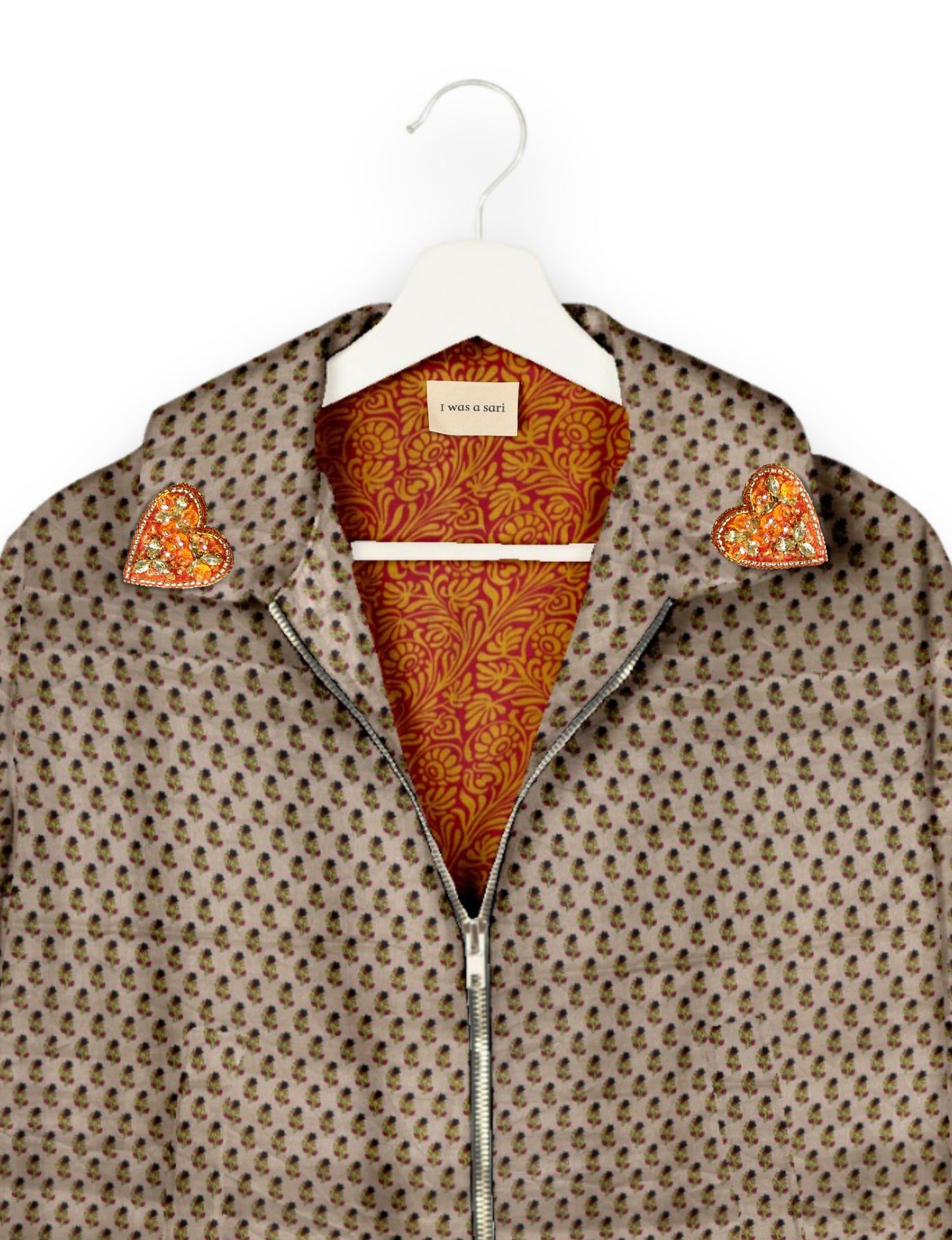 Make a bold statement with our Heart Drop Earrings, a symbol of conscious luxury and ethical fashion. Handcrafted using the intricate Aari embroidery technique, these earrings are made from upcycled sari fabric, embracing slow fashion and zero waste clothing. Elevate your look with sustainable apparel that supports fair trade fashion while reducing textile waste. Choose eco-friendly fashion that speaks of love, artistry, and responsibility.