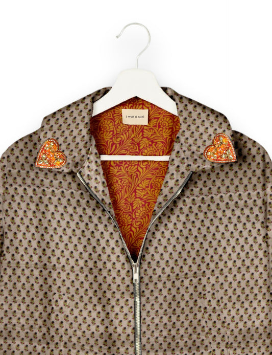 Make a bold statement with our Heart Drop Earrings, a symbol of conscious luxury and ethical fashion. Handcrafted using the intricate Aari embroidery technique, these earrings are made from upcycled sari fabric, embracing slow fashion and zero waste clothing. Elevate your look with sustainable apparel that supports fair trade fashion while reducing textile waste. Choose eco-friendly fashion that speaks of love, artistry, and responsibility.