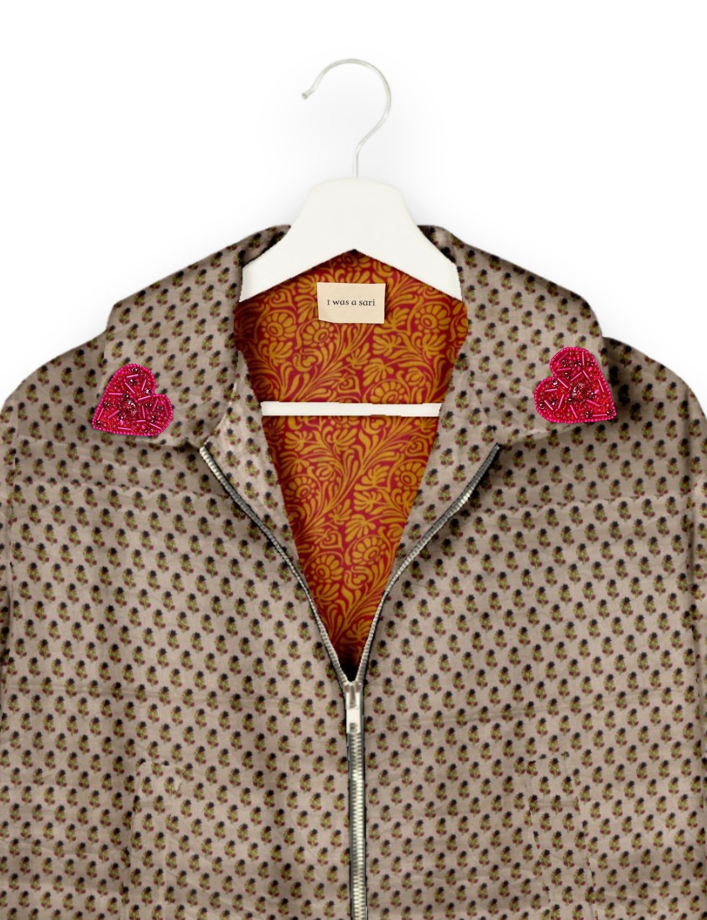 Make a bold statement with our Heart Drop Earrings, a symbol of conscious luxury and ethical fashion. Handcrafted using the intricate Aari embroidery technique, these earrings are made from upcycled sari fabric, embracing slow fashion and zero waste clothing. Elevate your look with sustainable apparel that supports fair trade fashion while reducing textile waste. Choose eco-friendly fashion that speaks of love, artistry, and responsibility.