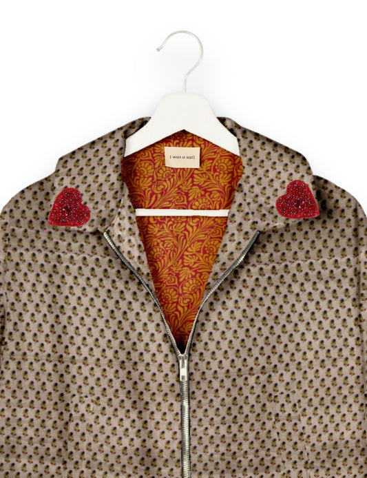 Make a bold statement with our Heart Drop Earrings, a symbol of conscious luxury and ethical fashion. Handcrafted using the intricate Aari embroidery technique, these earrings are made from upcycled sari fabric, embracing slow fashion and zero waste clothing. Elevate your look with sustainable apparel that supports fair trade fashion while reducing textile waste. Choose eco-friendly fashion that speaks of love, artistry, and responsibility.