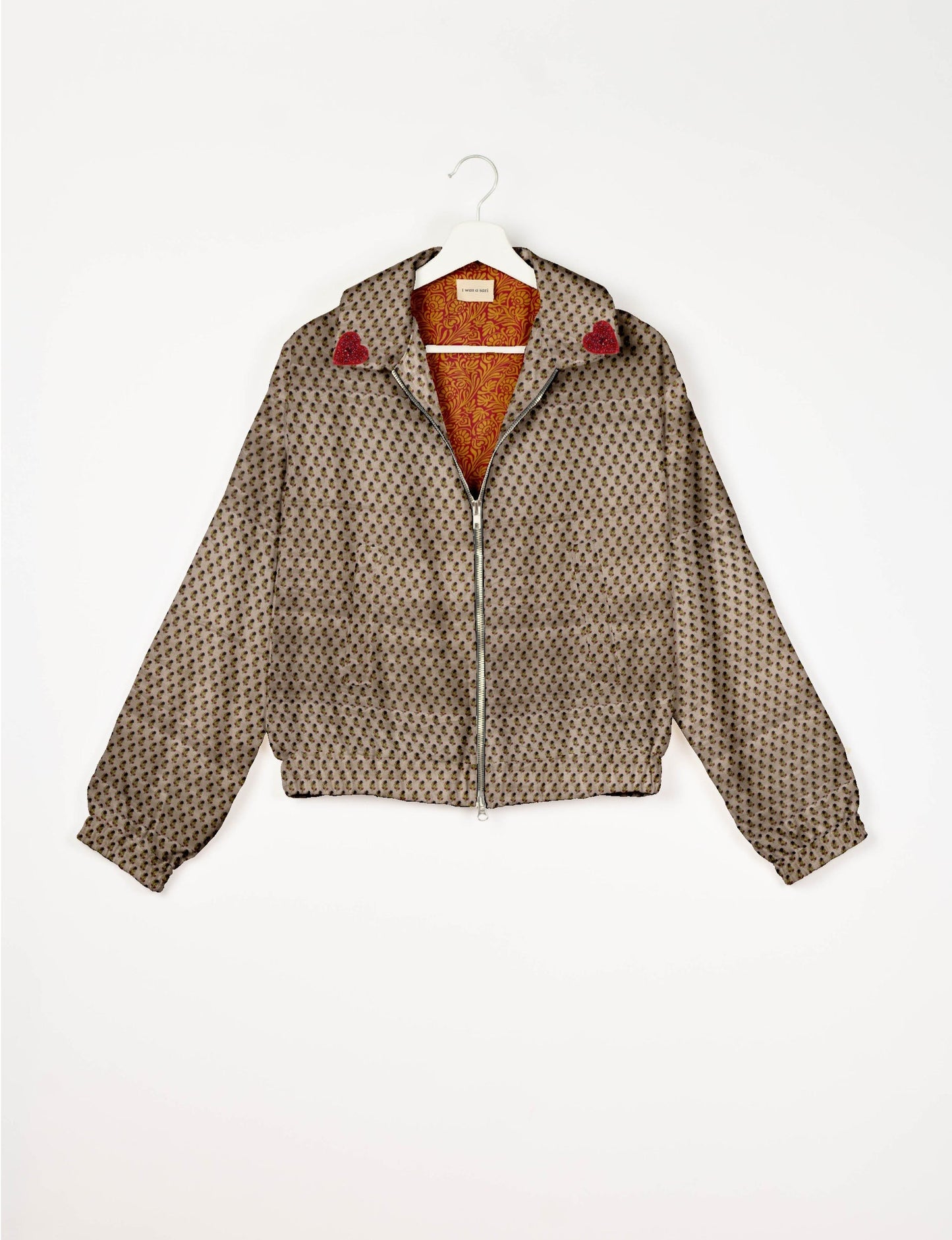 Make a bold statement with our Heart Drop Earrings, a symbol of conscious luxury and ethical fashion. Handcrafted using the intricate Aari embroidery technique, these earrings are made from upcycled sari fabric, embracing slow fashion and zero waste clothing. Elevate your look with sustainable apparel that supports fair trade fashion while reducing textile waste. Choose eco-friendly fashion that speaks of love, artistry, and responsibility.