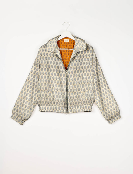 Stylish BOMBER JACKET, an upcycled clothing masterpiece with a cute cropped shape, elasticated details, and detachable metallic zipper. Contrast sari print lining adds a unique touch. Explore sustainable and eco-friendly fashion.