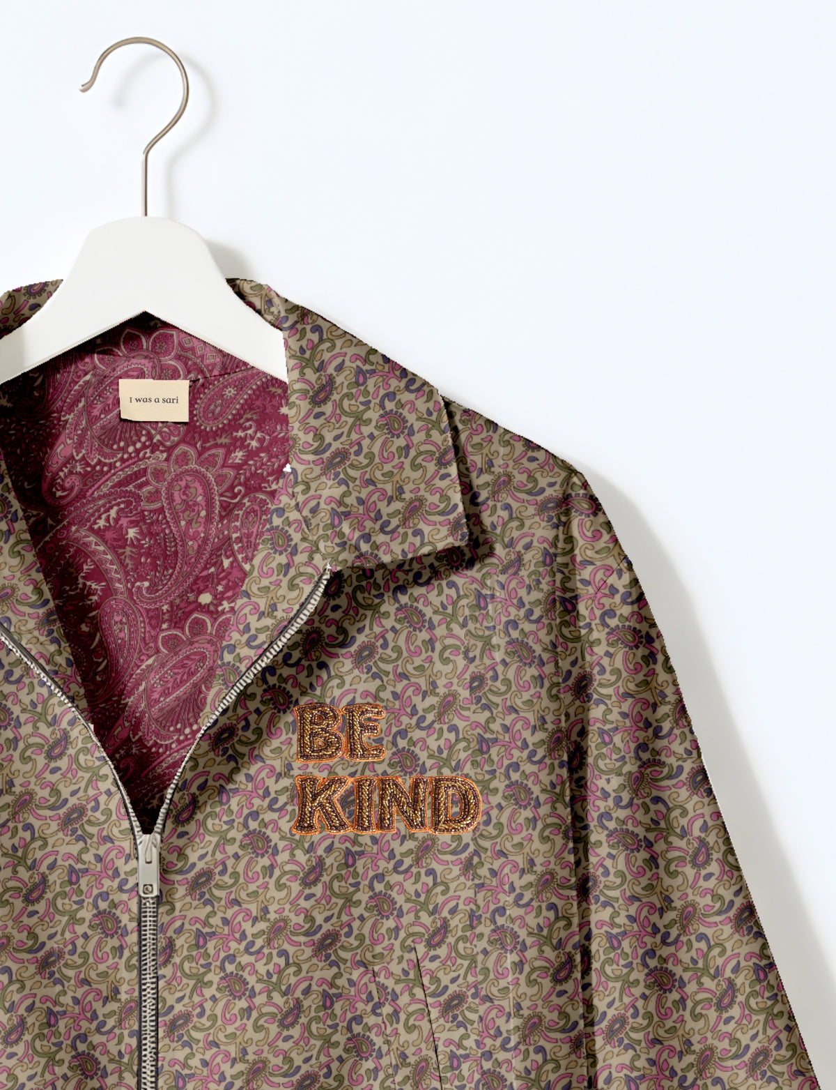 BE KIND Bomber jacket made from upcycled sari fabric with handcrafted Aari embroidery by female artisans.