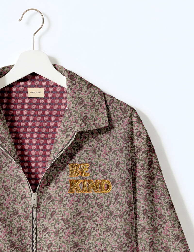 BE KIND Bomber jacket made from upcycled sari fabric with handcrafted Aari embroidery by female artisans.