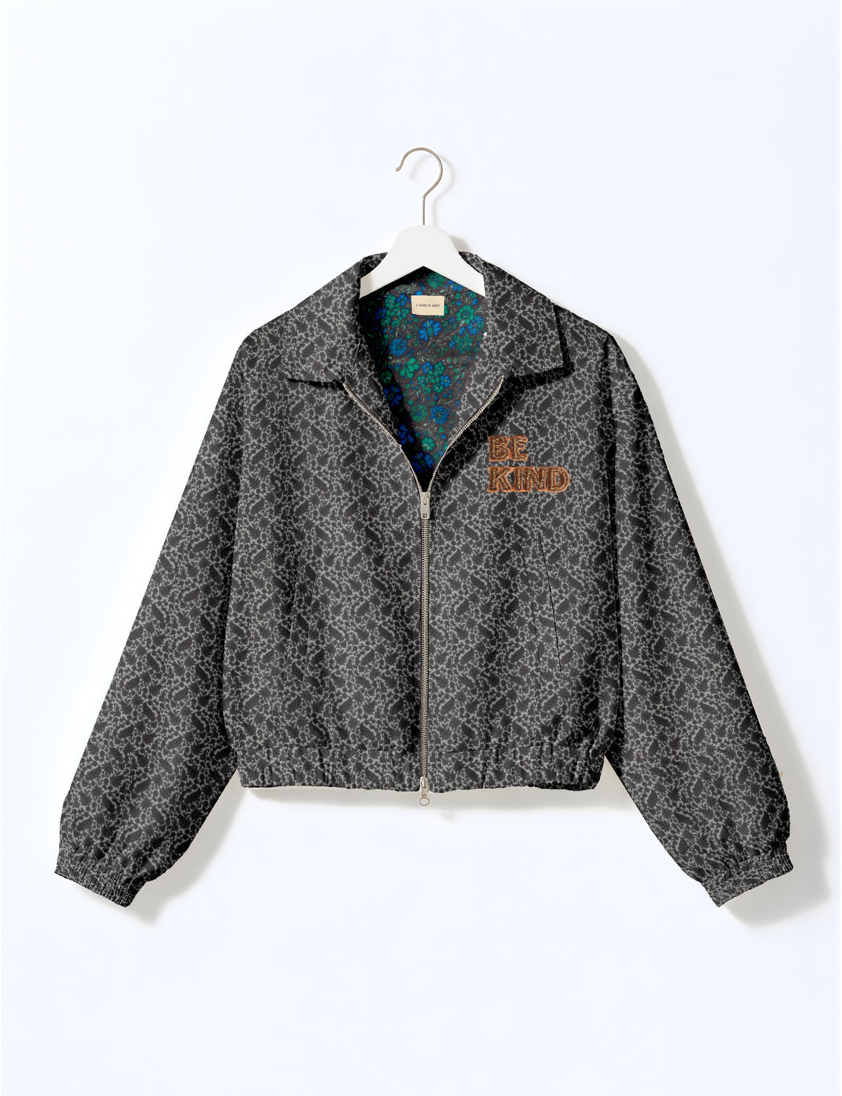 BE KIND Bomber jacket made from upcycled sari fabric with handcrafted Aari embroidery by female artisans.