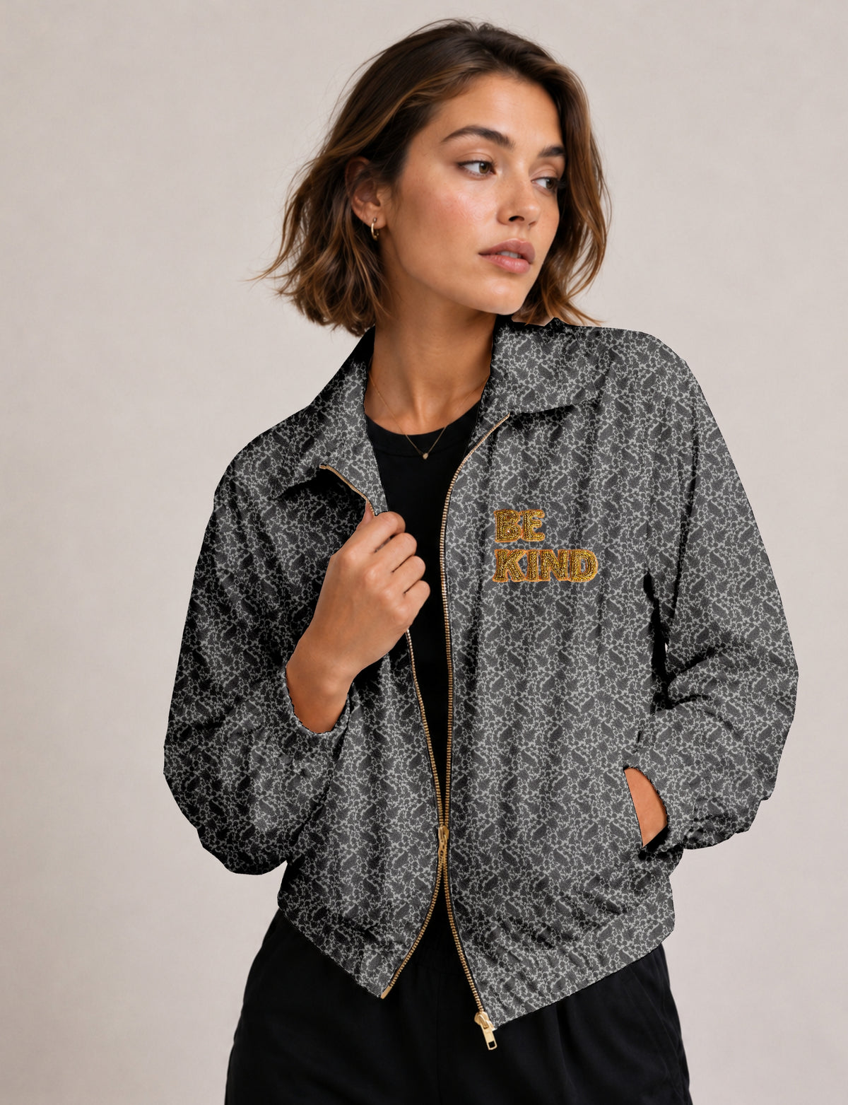 BE KIND Bomber jacket made from upcycled sari fabric with handcrafted Aari embroidery by female artisans.