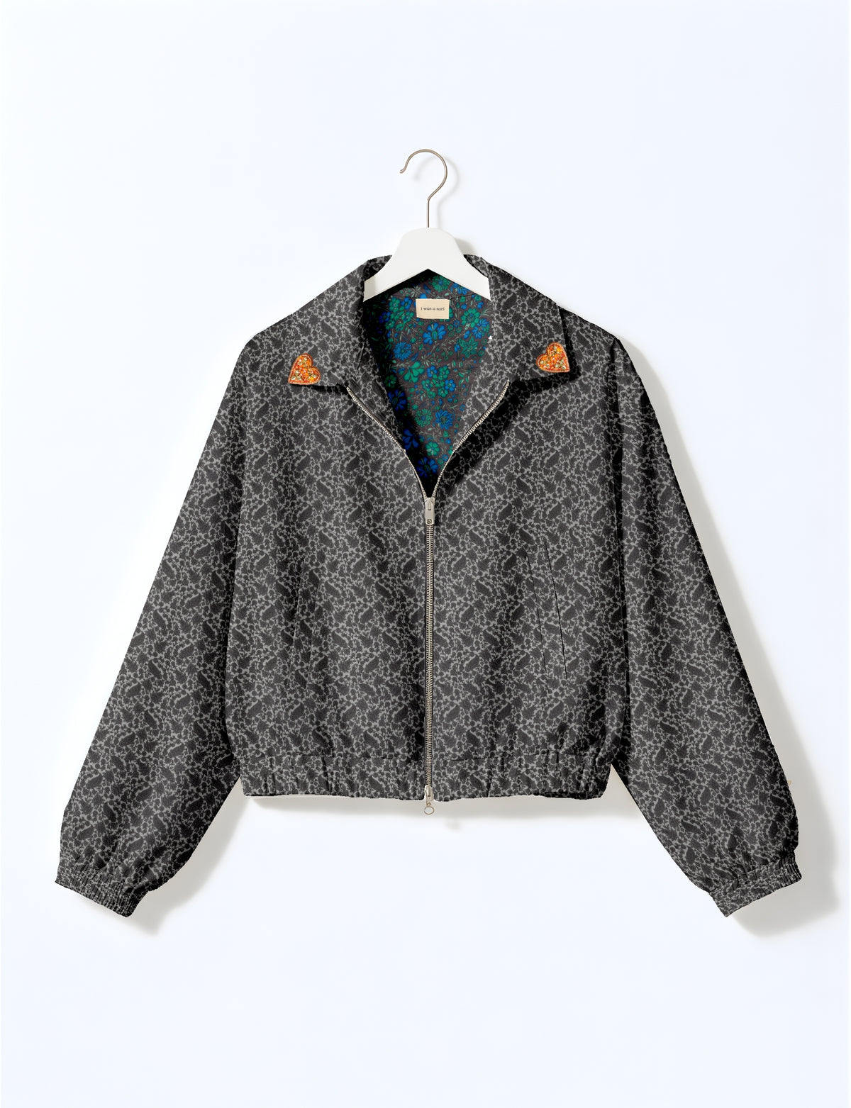 Love Bomber Jacket made from recycled fabric, featuring hand-stitched Aari embroidery. A unique piece of zero-waste clothing, part of the circular fashion movement. Designed with upcycled materials for a stylish yet environmentally friendly clothing choice.