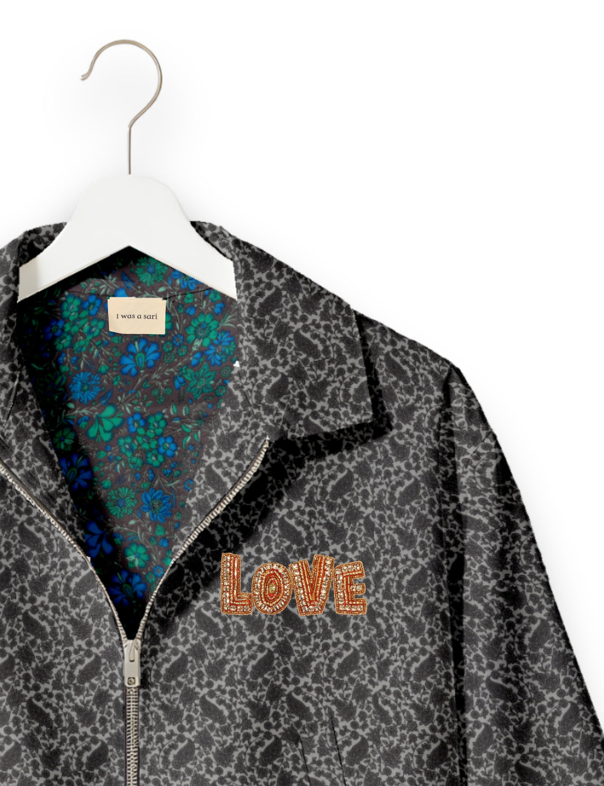 Love Bomber Jacket made from recycled fabric, featuring hand-stitched Aari embroidery. A unique piece of zero-waste clothing, part of the circular fashion movement. Designed with upcycled materials for a stylish yet environmentally friendly clothing choice.