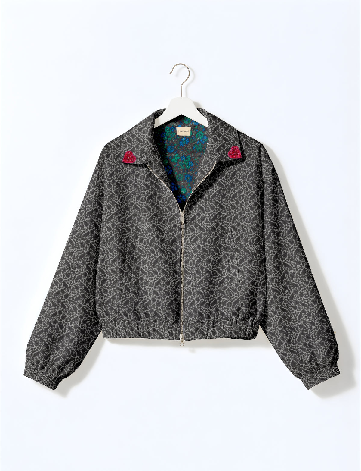 Love Bomber Jacket made from recycled fabric, featuring hand-stitched Aari embroidery. A unique piece of zero-waste clothing, part of the circular fashion movement. Designed with upcycled materials for a stylish yet environmentally friendly clothing choice.