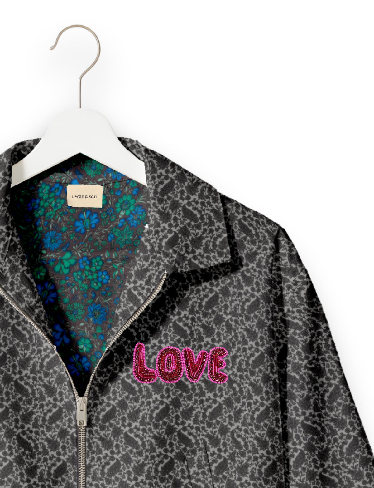 Love Bomber Jacket made from recycled fabric, featuring hand-stitched Aari embroidery. A unique piece of zero-waste clothing, part of the circular fashion movement. Designed with upcycled materials for a stylish yet environmentally friendly clothing choice.