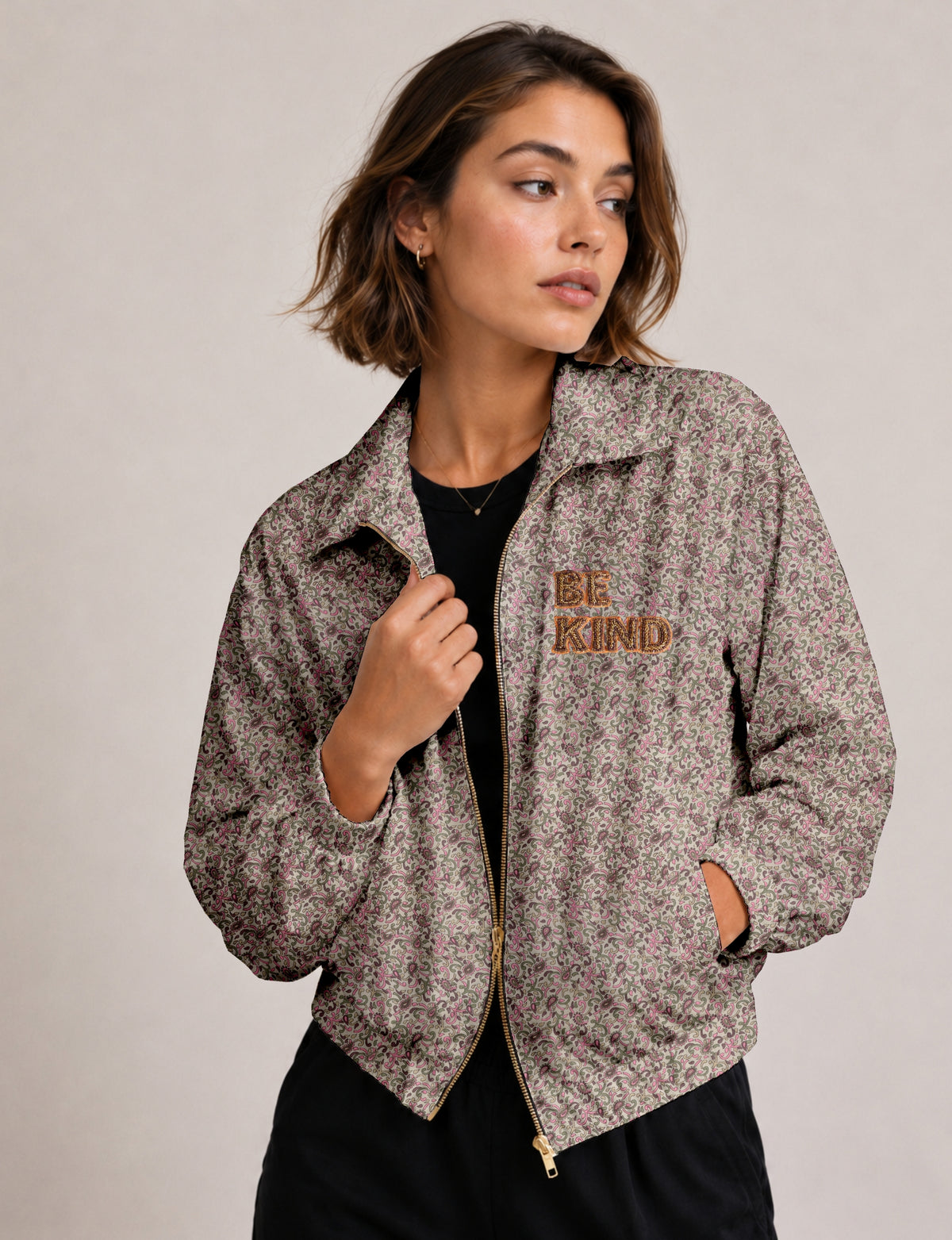 BE KIND Bomber jacket made from upcycled sari fabric with handcrafted Aari embroidery by female artisans.